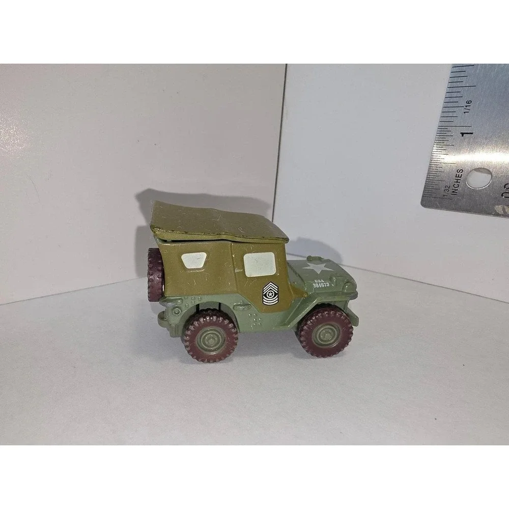 Disney/Pixar Cars Sarge diecast vehicle, specifically from the 1:55 scale Mattel